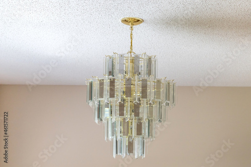 An old-fashioned retro hanging glass chandelier in a dining room photo