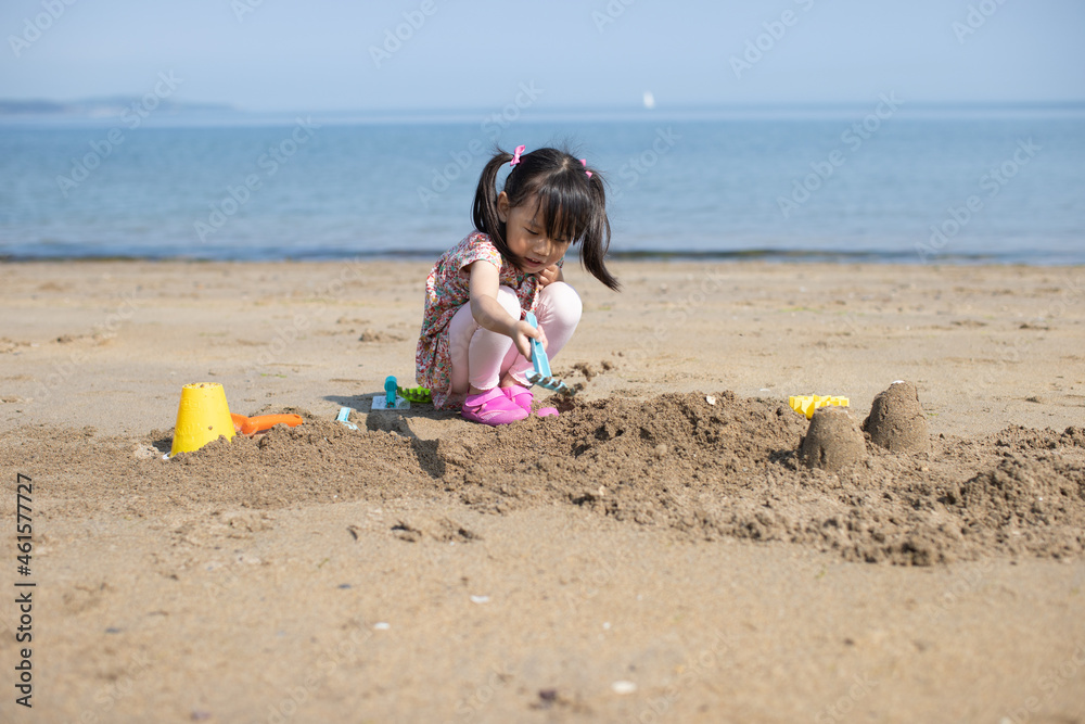 young girl playing at summer sand beach young girl playing at summer sand beach