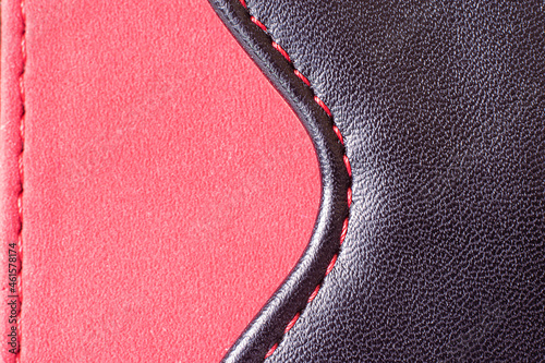 Part of a product made of red fabric with a leather insert