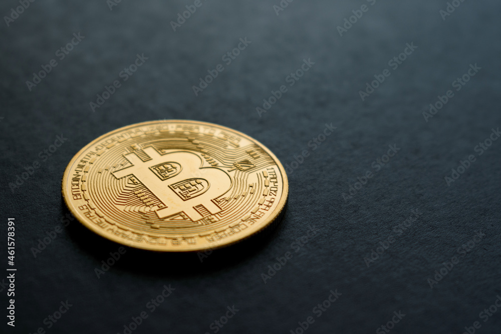 bitcoin crypto currency in gold color on black background bitcoin crypto currency in gold color on black background