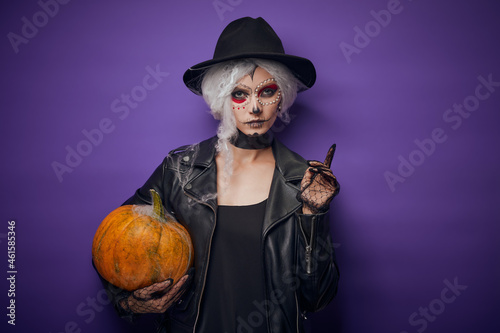 Cheerful young woman in Halloween costume