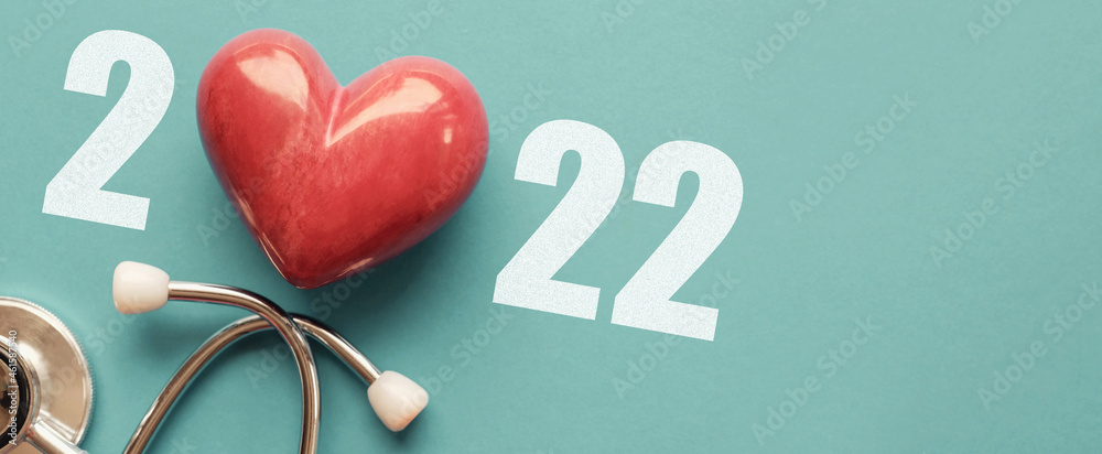 2022 with Red heart nad stethoscope, heart health,  health insurance concept, new year resolutions goal - obrazy, fototapety, plakaty 