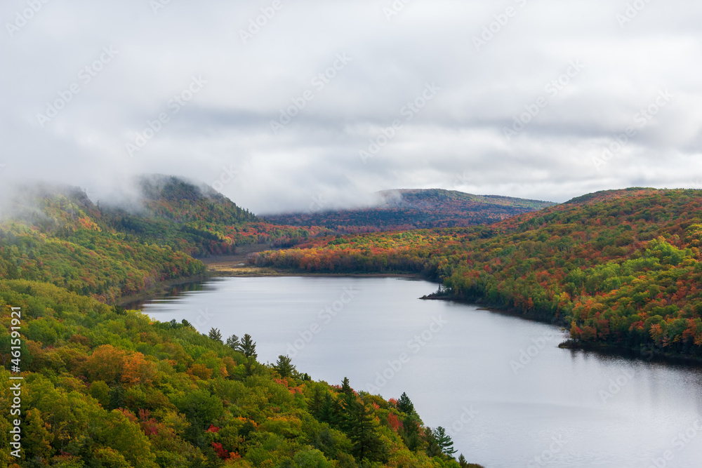Autumn landscape with colorful foliage and mountain lake