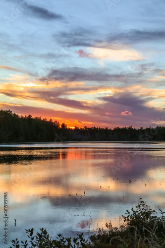 Spectacle Pond near Moosehead Lake, Maine, at sunset with beautiful cloudscape colors © rabbitti