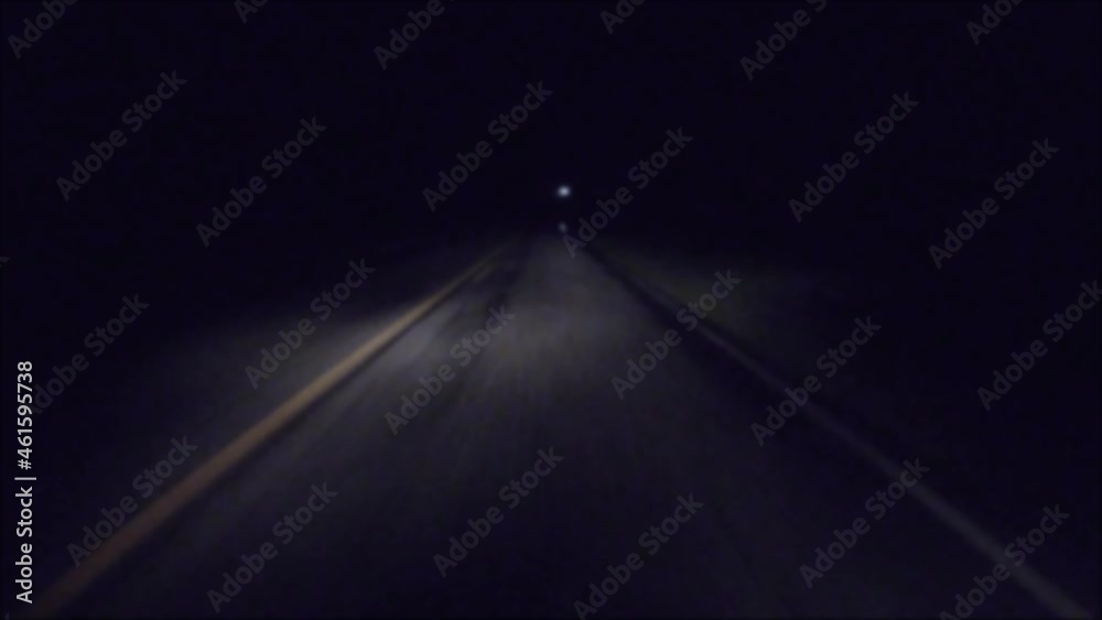 POV FPV driving in the rain at night on a dark country road passing a car