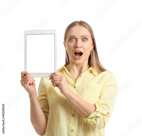 Surprised young woman holdi...