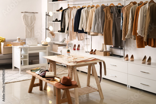 Stylish interior of modern store with clothes and accessories © Pixel-Shot