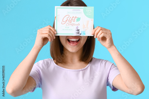 Happy young woman with gift...