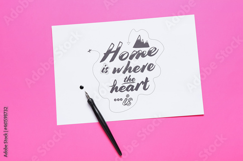 Paper with text HOME IS WHE...