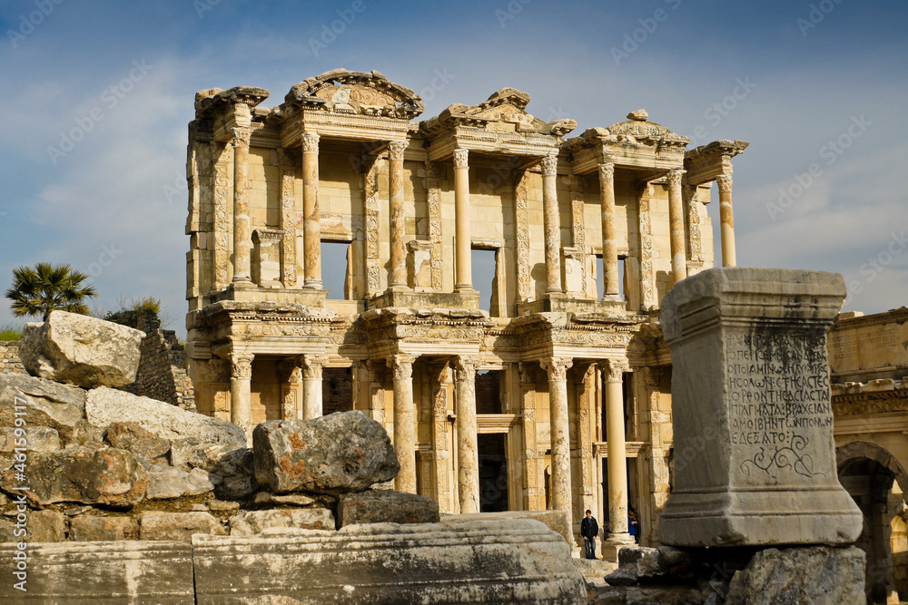 Fototapeta premium The ruined facade of the magnificent Library of Celsus stands amid tumbled Roman columns and blocks, Ephesus, Turkey