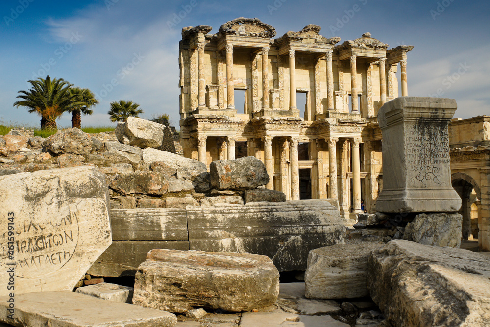  The ruined facade of the magnificent Library of Celsus stands amid tumbled Roman columns and blocks, Ephesus, Turkey
