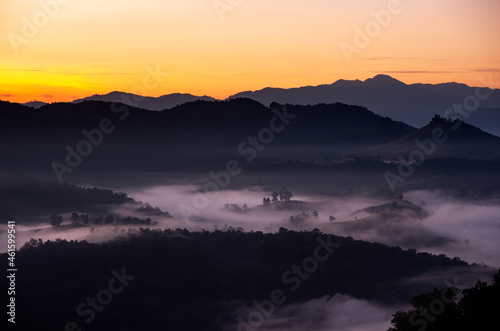 Aerial view Beautiful of morning scenery Golden light sunrise And the mist flows on high mountains, Baan Ja Bo, Mae Hong Son, Thailand.