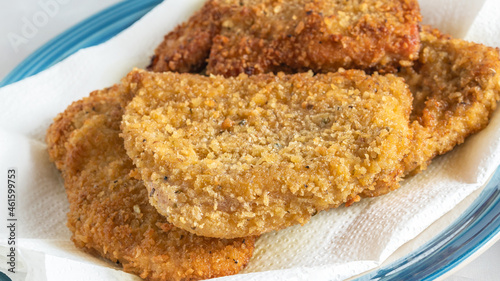 Deep fried breaded pork chops close up