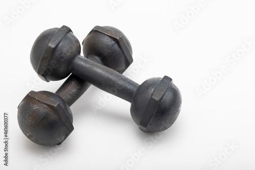 Abandoned old rusty dumbbell on a white background , Neglect of health care concept