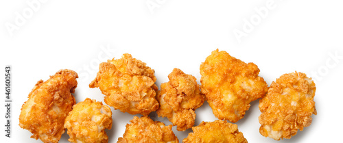 Crunchy fried popcorn chicken on white background