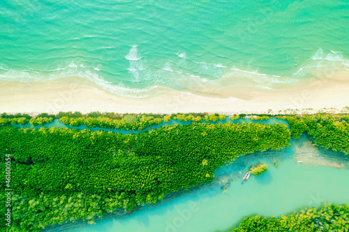 The aerial views, sea waves and mangrove forests are clear sky on a bright day. Phetchaburi Province, Thailand. photo