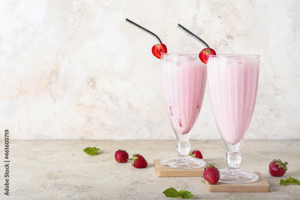 Glasses of strawberry Pina Colada cocktail and berries on grunge background - obrazy, fototapety, plakaty 