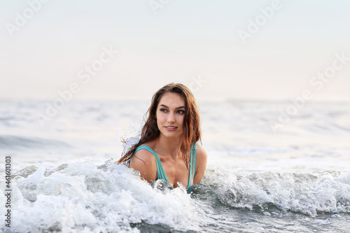 Beautiful young woman swimming in sea © Pixel-Shot