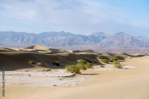 Mesquite Sand Dunes  mountains and cloudy sky background in Death Valley National Park  California