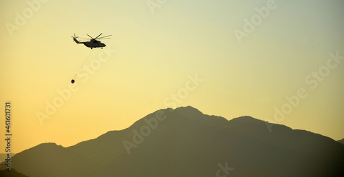 Russian helicopter draws water from the sea to extinguish a forest fire. Marmaris,Turkey