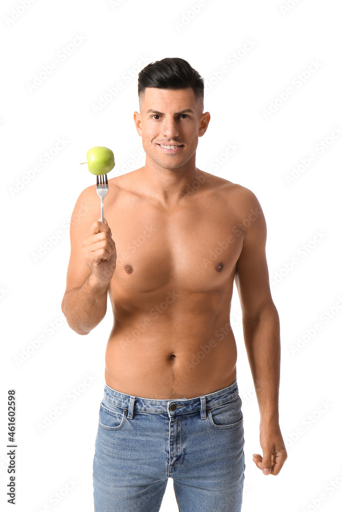 Young man with apple on white background. Vegan Day Young man with apple on white background. Vegan Day