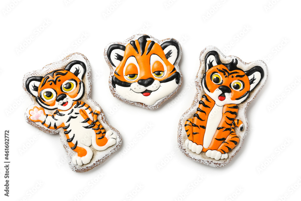 Cute cookies in shape of tiger for New Year 2022 on white background Cute cookies in shape of tiger for New Year 2022 on white background