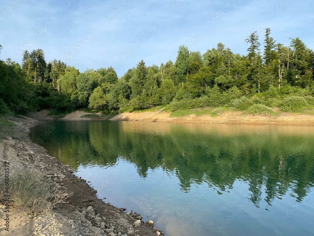 Obraz premium Artificial reservoir Lake Lokve or Artificial accumulation Lokvarsko Lake - Gorski kotar, Croatia (Lokvarsko jezero ili umjetno akumulacijsko Omladinsko jezero, Lokve - Gorski kotar, Hrvatska)