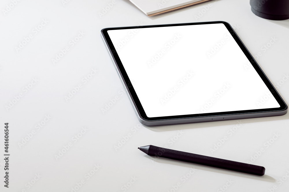 Mockup portable tablet with stylus pen on white top table. Mockup portable tablet with stylus pen on white top table.