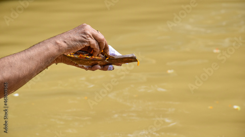 Fototapeta Naklejka Na Ścianę i Meble -  TARPAN - A Hindu ritual, the sacrament of offering drinking water to the manes. This is well practised on Mahalaya day by hindu devotees on the banks of the holy river Ganga.