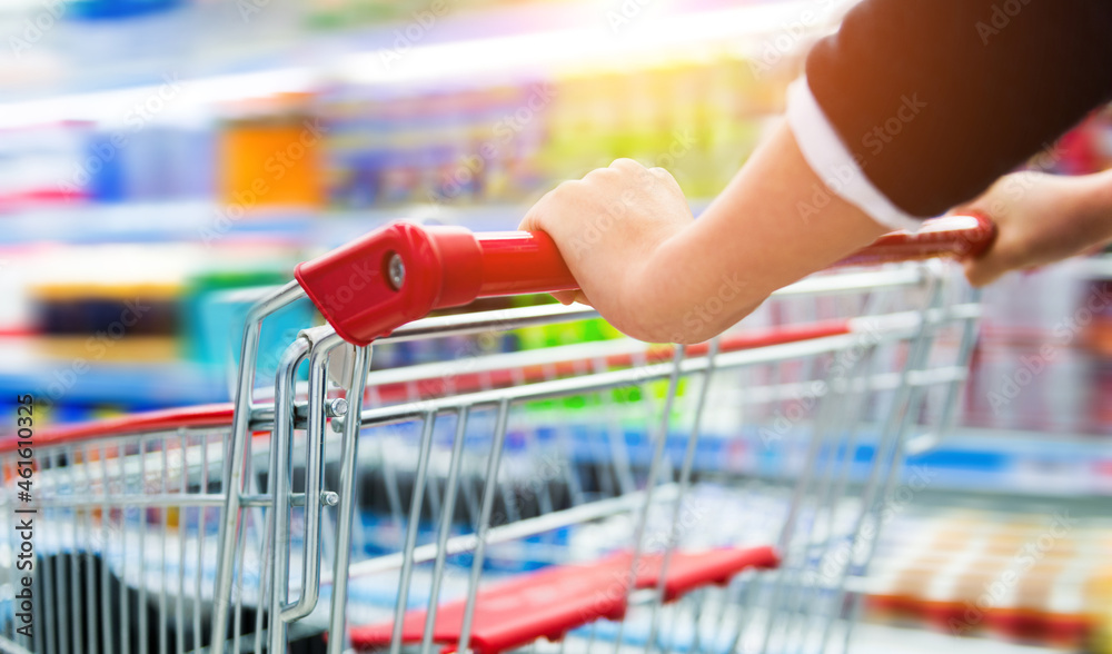 Closeup view of woman with shopping cart