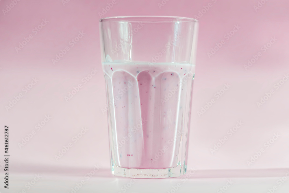 Homemade blueberry or currant smoothie fruits or yogurt on pink background. Concept of proper nutrition and healthy eating. Organic and vegetarian drink Homemade blueberry or currant smoothie fruits or yogurt on pink background. Concept of proper nutrition and healthy eating. Organic and vegetarian drink