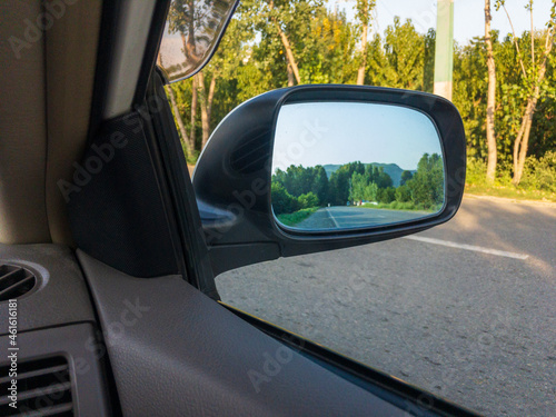 Car side mirror reflection landscape view © GreenThumbShots
