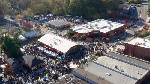 Drone view of a large crowd of people at an event in the downtown area of Acworth, Georgia photo