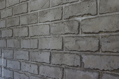 Gray wall in the form of brickwork repair and decoration of walls  taken close-up