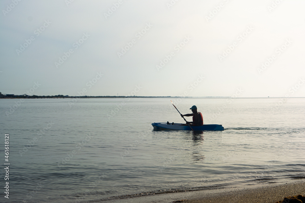 Sunrise kayaking through backwaters