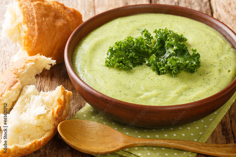 Delicious homemade kale puree soup close-up in a bowl on the table. horizontal Delicious homemade kale puree soup close-up in a bowl on the table. horizontal