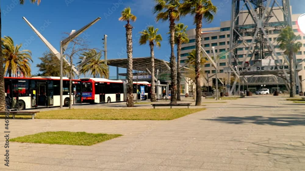 particular tower of the cable car the port of Barcelona where we see a hotel in the background and the cameras pan showing us the tower autumn colors beside the palm trees around particular tower of the cable car the port of Barcelona where we see a hotel in the background and the cameras pan showing us the tower autumn colors beside the palm trees around