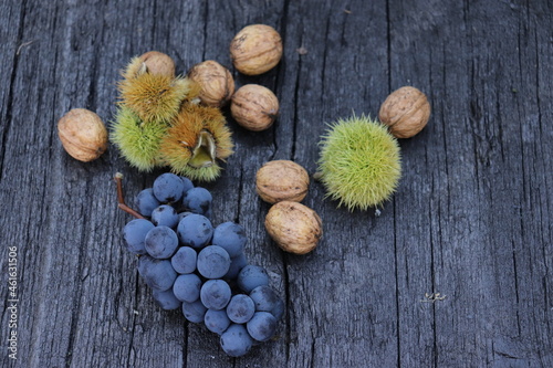 bunch of grapes on wooden background, place for text 