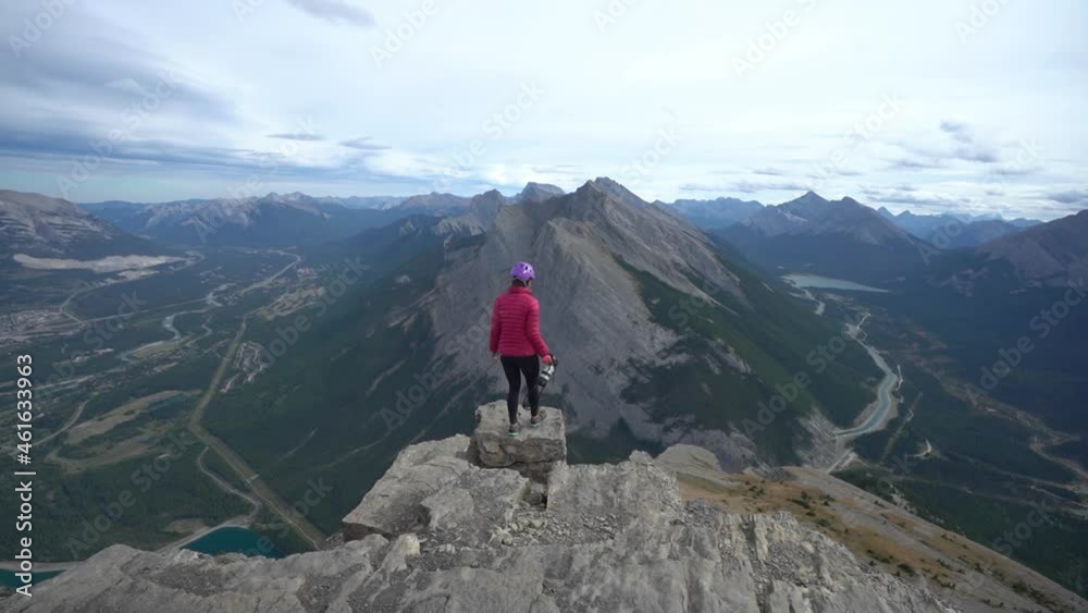Female on Peak Top With Magnificent View on Glacier National Park, Montana, USA and Valley With Many Lakes, Slow Motion Full Frame Female on Peak Top With Magnificent View on Glacier National Park, Montana, USA and Valley With Many Lakes, Slow Motion Full Frame