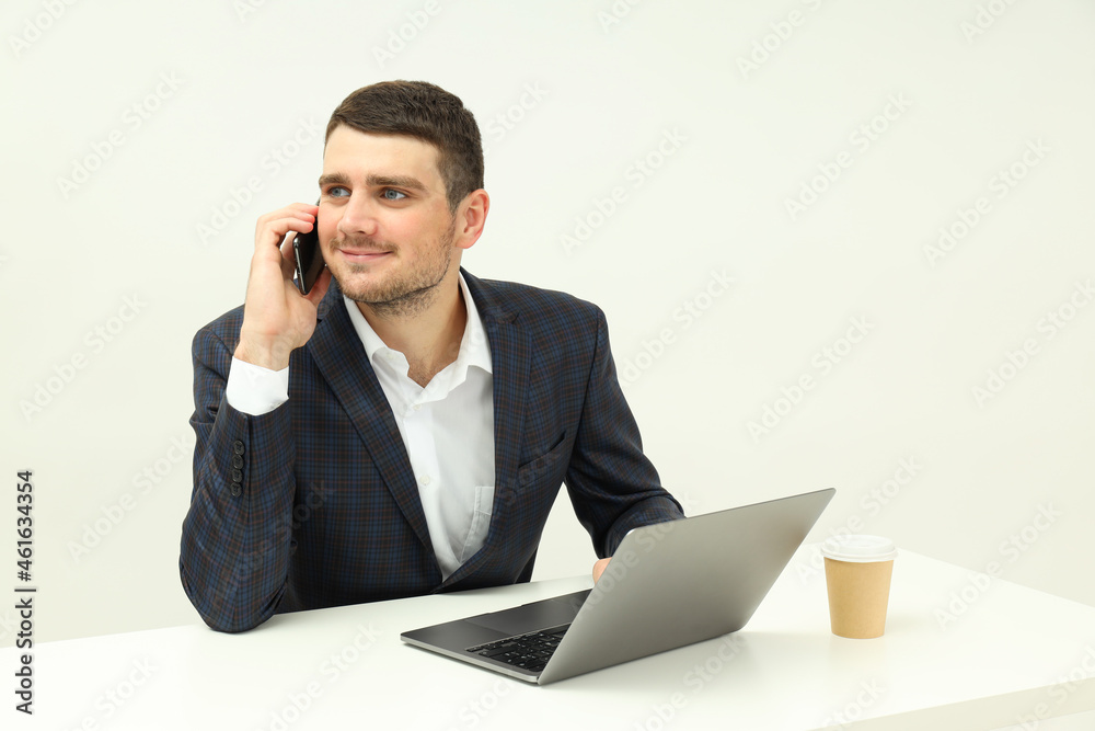 Business concept with young man talking on the phone Business concept with young man talking on the phone
