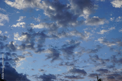 Fluffy white clouds and blue sky