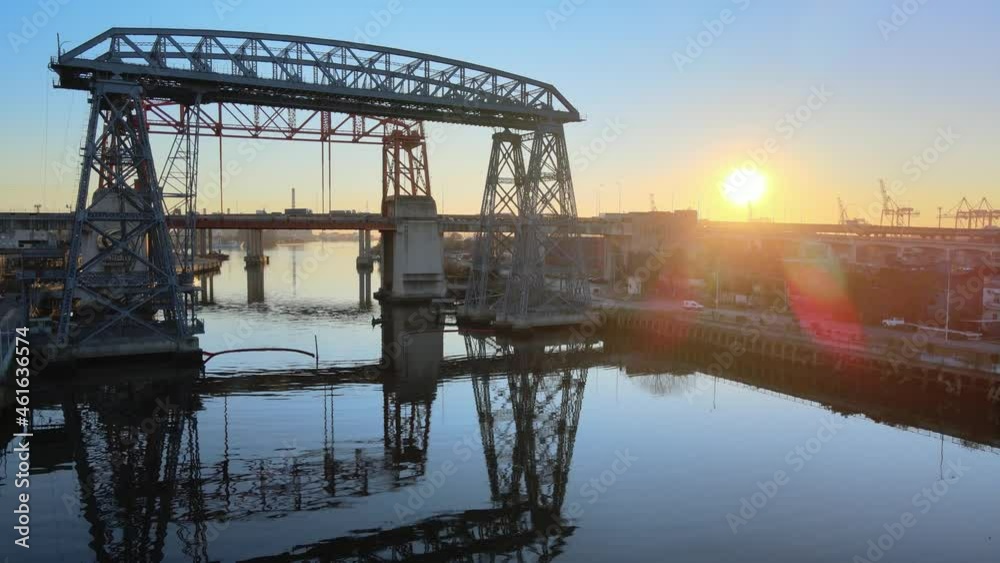 Aerial over Matanza river of Nicolas Avellaneda ferry bridge during sunset, La Boca Aerial over Matanza river of Nicolas Avellaneda ferry bridge during sunset, La Boca