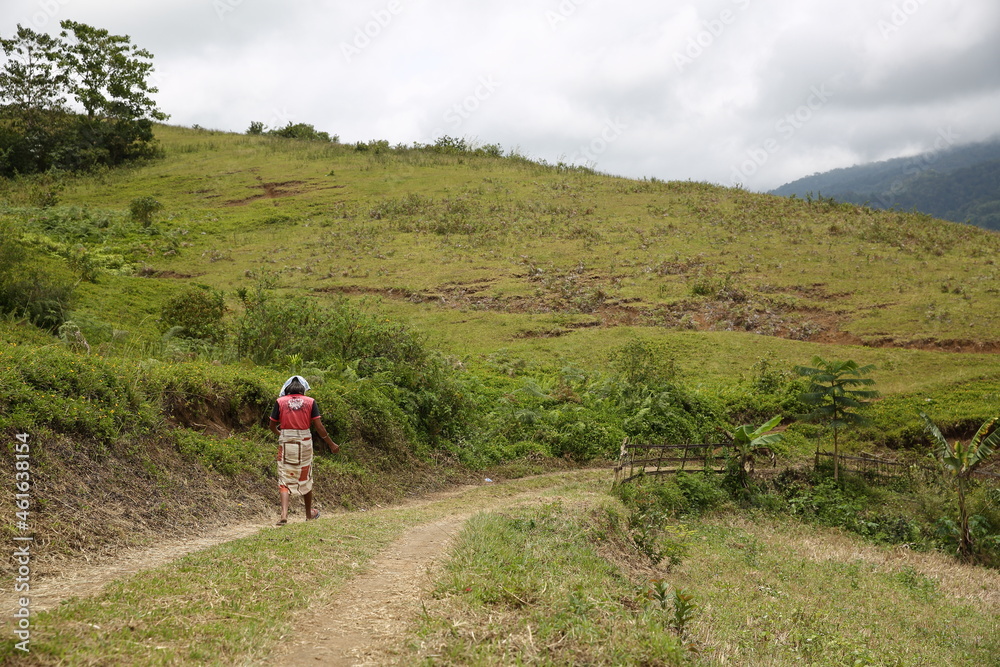 a local women walking on the trail road of mountain in lanao del sur, mindanao island