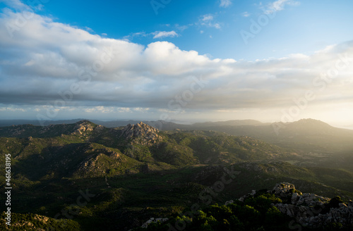 View from above, stunning landscape with a mountain range and a valley during a beautiful sunrise. Panoramic view from Monte Pino, (Vedetta Monte Pino) Sardinia, Italy.