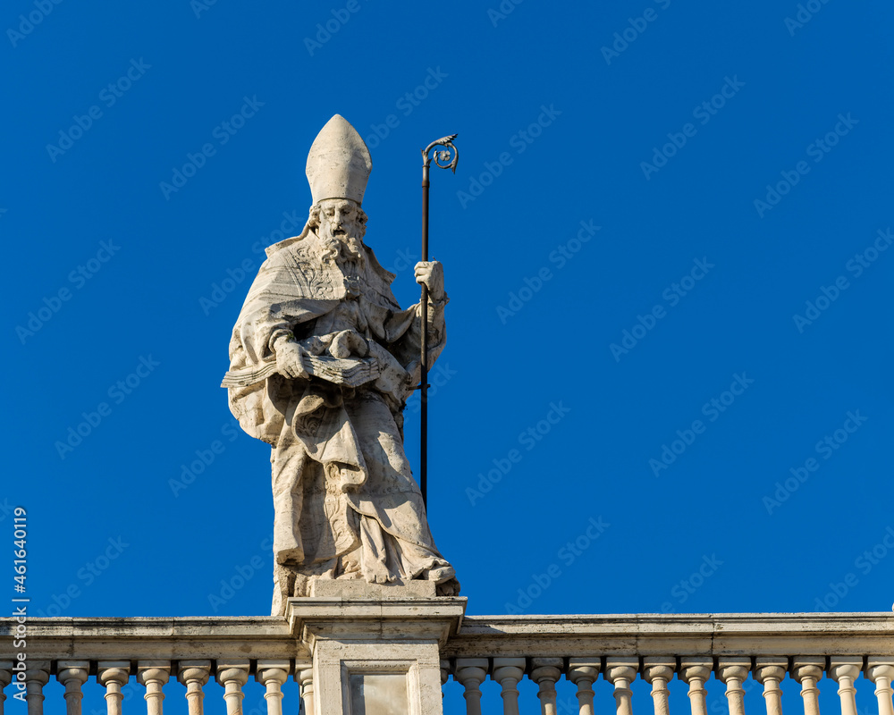 Statue on the roof of the Papal Archbasilica of St. John in Lateran (Basilica di San Giovanni in Laterano), Italy, Rome