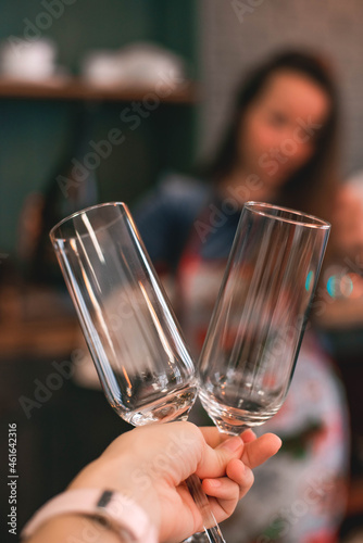Close-up of two champagne glasses in hand