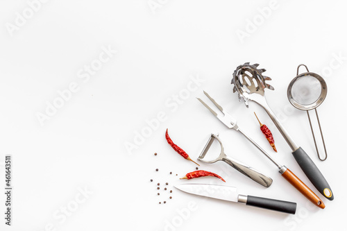 Flat lay of metal kitchen utensils and cookware