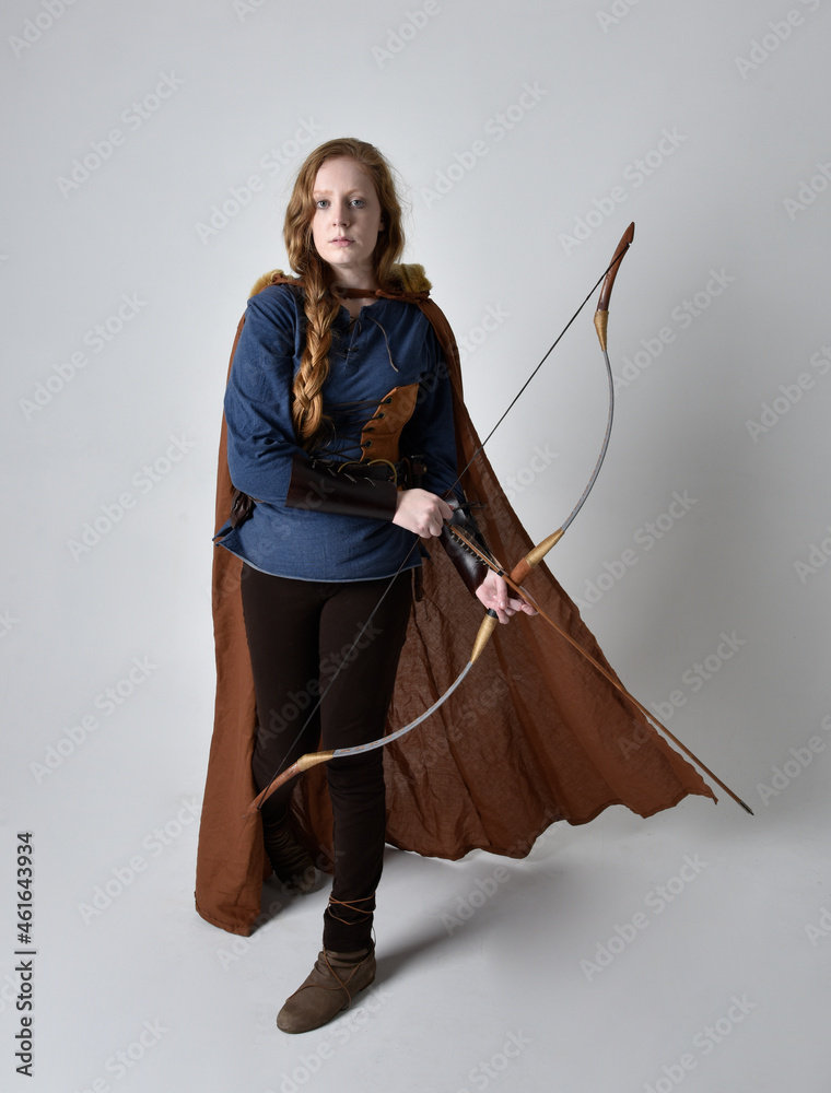 Full length, portrait of red haired woman wearing medieval viking ...