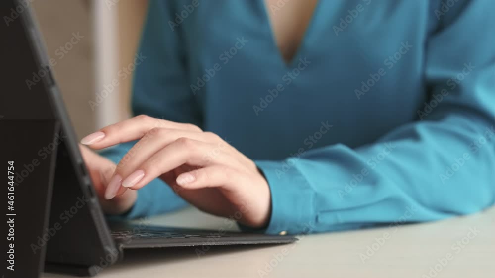 Laptop working. Remote job. Freelance lifestyle. Wireless device. Closeup of business woman hands using modern technology notebook typing sending email at office desk workplace. Laptop working. Remote job. Freelance lifestyle. Wireless device. Closeup of business woman hands using modern technology notebook typing sending email at office desk workplace.