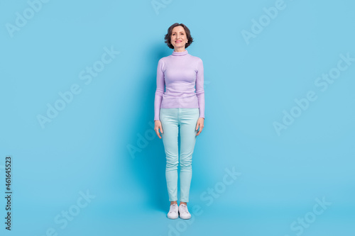 Full size photo of attractive mature woman happy positive smile wear casual outfit isolated over blue color background